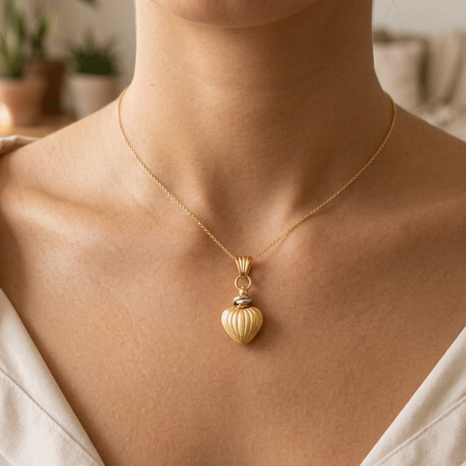 Dije Forma de Corazón en Oro Amarillo y Oro Blanco 18k