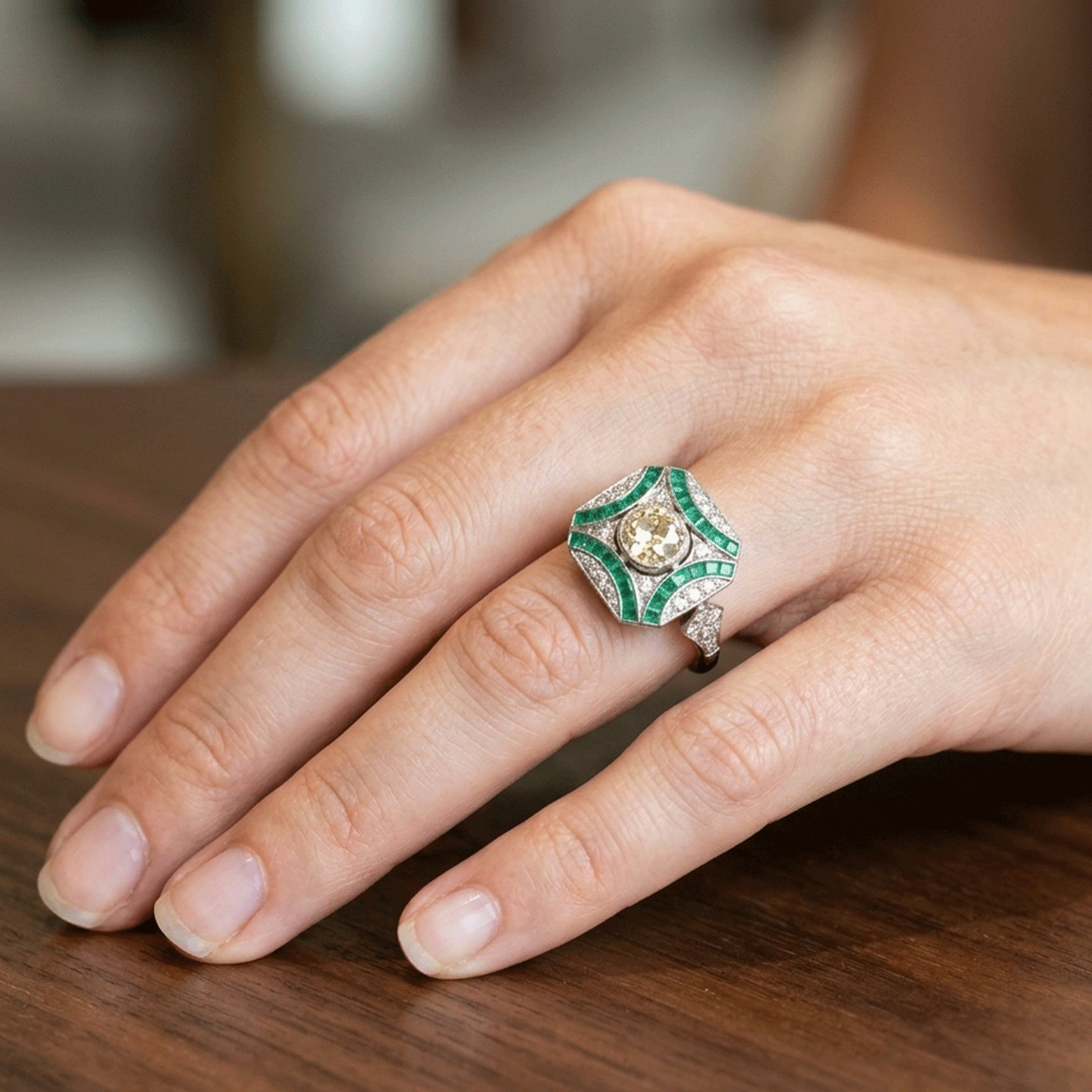 Art Deco Platinum Ring with Emeralds and 0.84 ct Brilliant
