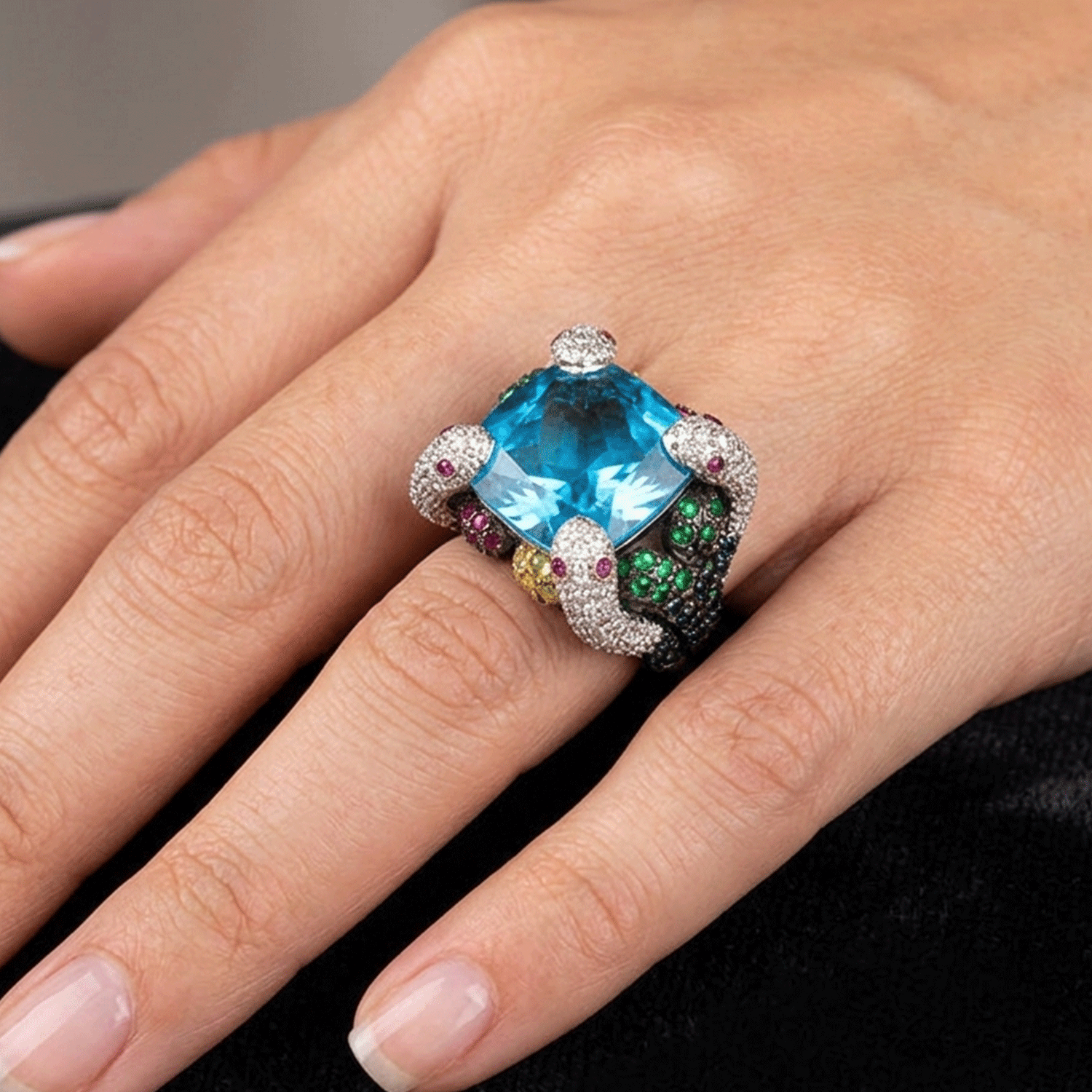 Majestic White Gold Ring with Central Topaz, Four Snakes Adorned with Diamonds, Topazes, Sapphires, Rubies and Emeralds